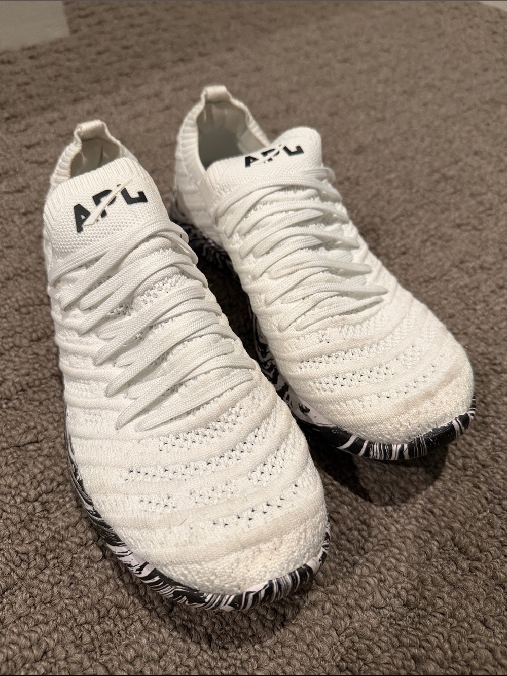 APL White Knit Slip-On Sneakers with Black Logo and Marbled Sole